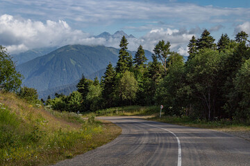 Asphalt road leading to the mountains