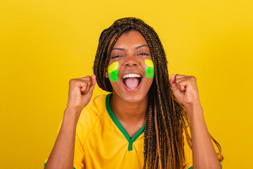 black woman young brazilian soccer fan. close-up photo, screaming goal, celebrating. soccer brazil.