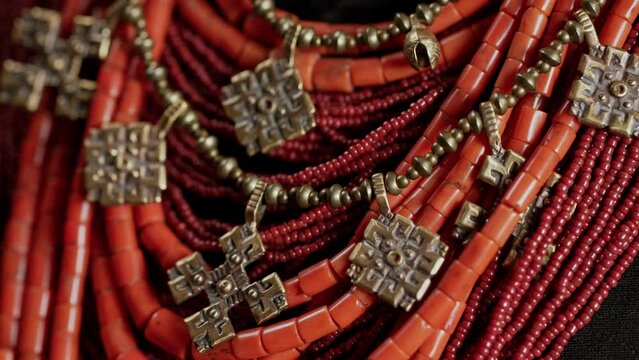 Demonstrating traditional antique jewelry necklace. National costume of Ukraine. Ukrainian woman in legacy ancient coral beads, Zgarda - archaic hutsul neck ornament of status religious purpose