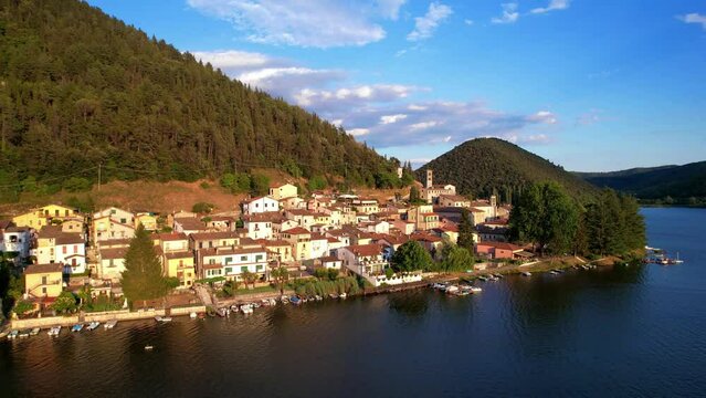 Most beautiful scenic Italian lakes - small picturesque lake Piediluco with colorful houses in Umbria, Terni province. Aerial drone video
