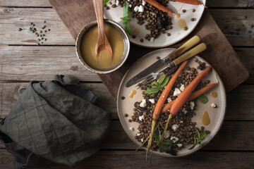 Served plates of organic salad on wooden table