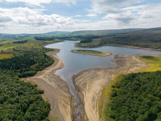 Fototapeta premium Drought conditions are shown through drone shots of Stocks Reservoir