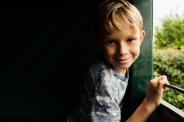 portrait of a boy smiling on a tractor ride