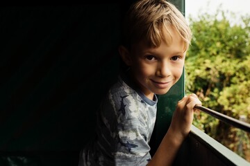 portrait of a boy on a tractor ride in the countryside