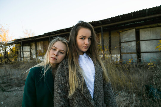 LGBT Lesbian couple. Two girls standing close. head on shoulder