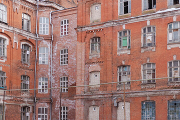 Tver. Quarter of old houses. Morozov barracks in winter. Brick walls, broken windows.