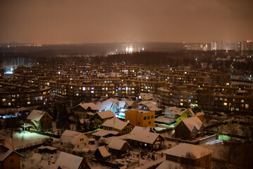 Three-storey apartment buildings. New district of Moscow in the evening. Turned off the street...