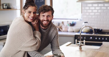 Happy, love and funny couple with coffee, morning tea or drink bonding in home kitchen together. Portrait of smile, playful people or comfort man and relax woman in house room, hotel or accommodation