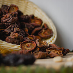 Dried wild pears in bowl, side view