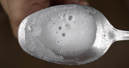 warm with a lighter drug spoon with opium, dose of heroin High quality 4k footage - Powered by Adobe