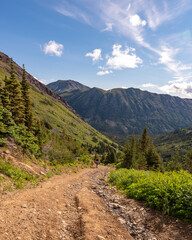 Hiking landscape views in Yukon Territory, Canada during summer with amazing wilderness views. 