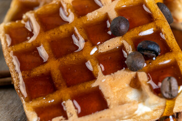 soft waffles with natural bee honey on a serving board