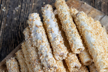 waffle tube with chocolate filling and crushed peanuts