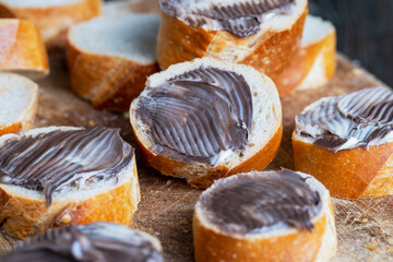 baguette with sweet chocolate butter on a board