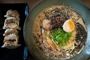 Mouth watering japanese ramen in a bowl served with egg