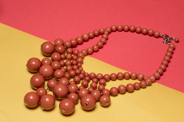 Pink Beaded Necklace photographed in a studio.