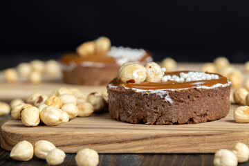 chocolate tartlet with cream filling and salted caramel with nuts
