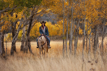 Wyoming Cowgirl at Work in the Fall