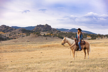 Wyoming Cowgirl at Work in the Fall