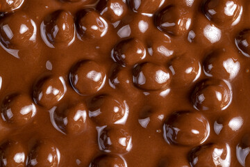 real milk chocolate while cooking with hazelnuts