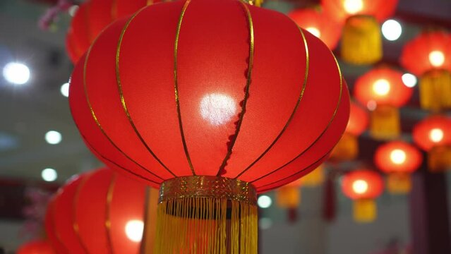 Slow rotation follow track red Chinese lantern ornament hanging during Chinese New Year