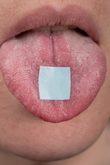 hippie use lsd mark ,lysergic acid in tongue closeup