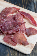 thin pieces of dried meat with spices