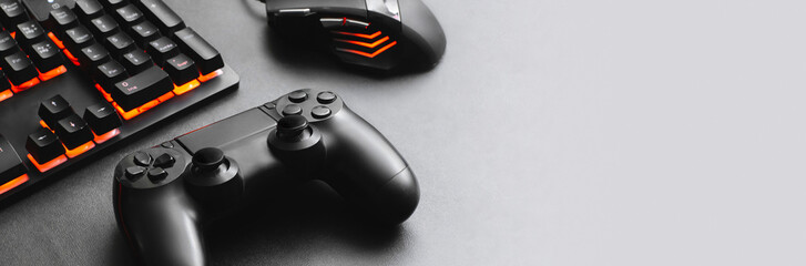 Horizontal banner of a keyboard and mouse for gamer together a joystick concept for online video games.