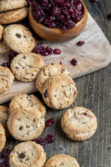 delicious dried cookies made of high-quality flour with dried red cranberries on the table