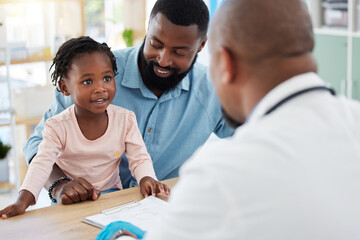 Doctor consulting with black family, baby and father in doctors office in hospital. Medicine...