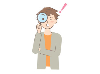 虫眼鏡をのぞく若い男性