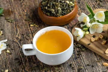 Brewed green tea with jasmine on the table