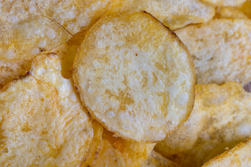 scattered potato chips with natural spices
