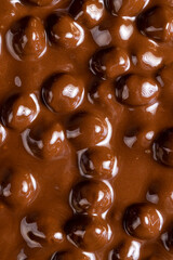 real milk chocolate while cooking with hazelnuts