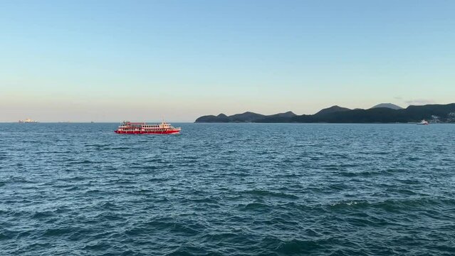 Cruise ship on  sea at windy day boat at ocean bay, cruising in deep blue open ocean sea.