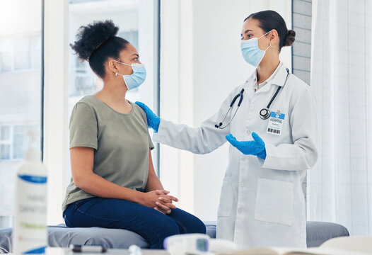 Medical nurse consulting a patient for covid before vaccine while wearing a face mask during pandemic. Healthcare worker with stethoscope discussing the virus injection with a woman in hospital room.