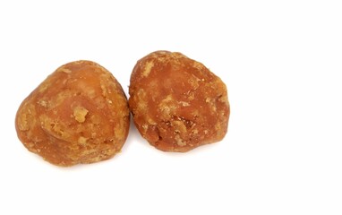 Closeup of Organic Palm Jaggery or Gur Isolated on White Background with Copy Space for Texts Writing