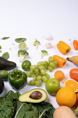 High angle view of various food arranged on white background with copy space