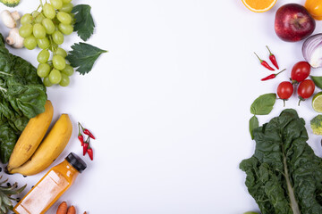 Directly above shot of various healthy food on white background with copy space