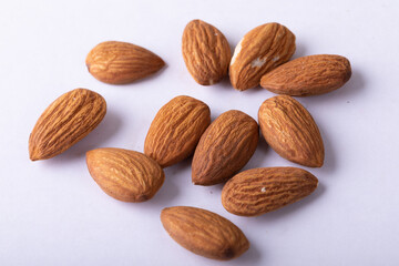 Extreme close-up of almonds on white background