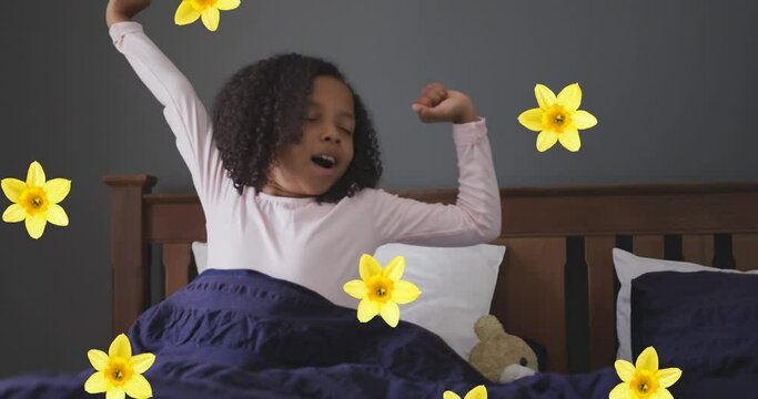 Animation of flowers over african american girl waking up
