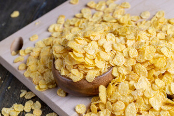 dry breakfast corn flakes of yellow color , close up
