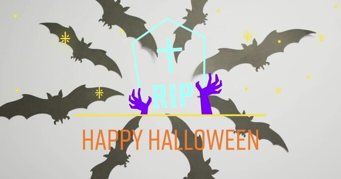 Animation of happy halloween text over tombstone and bats