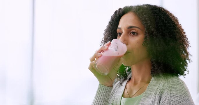 Woman drinking healthy smoothie milkshake for energy, nutrition and fresh wellness in detox, fruits diet and juice cleanse at home. Delicious, wholesome and weight loss vitamins, nutrients and vegan