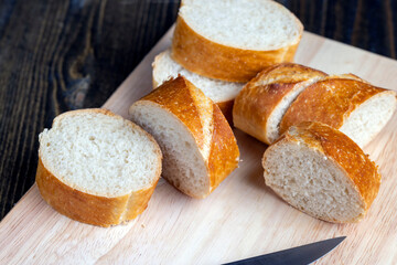 sliced into pieces a long baguette with a crispy crust