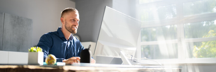 Employee Working On Desktop Computer