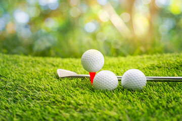 Golf ball on tee ready to be shot.  putting golf ball on tee in golf course