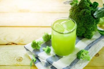 Glass of broccoli juice, broccoli Healthy drink on wood back ground, Green vegetable smoothie