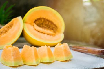 sliced of melons, fresh Melon or cantaloupe, Cantaloupe melons on wood background, Favorite fruit in summer