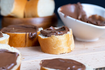 Chocolate butter spread on bread while cooking breakfast